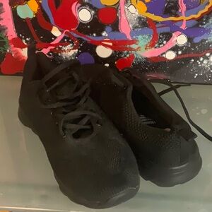 Sleek Black Athletic Shoes with Minimalist Design